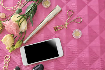 Composition with smartphone and accessories on color background. Beauty blogger concept