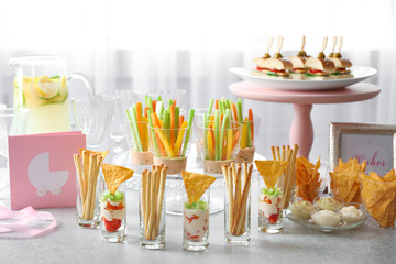 Tasty food for baby shower party on table