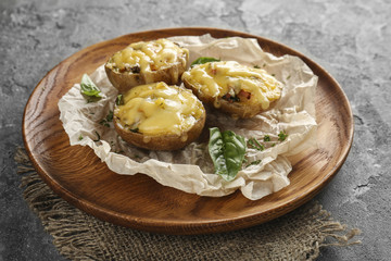 Stuffed potatoes on wooden tray