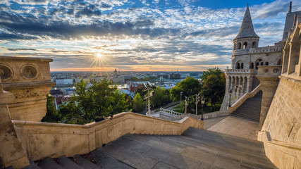 Fototapeta premium Budapest, Hungary - Staircase of the famous Fisherman Bastion on a beautiful sunny morning with sunrays and nice cloudy sky