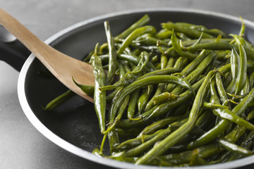 Delicious green beans in frying pan, closeup