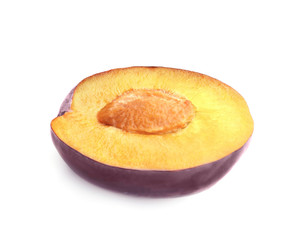 Half of ripe plum isolated on white