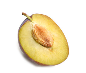 Half of ripe plum isolated on white