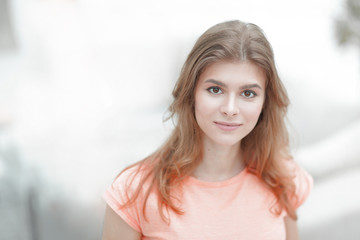 closeup portrait of a young woman on blurred background.