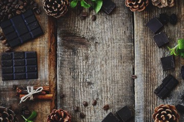 Beautiful Christmas wooden background with pine cones