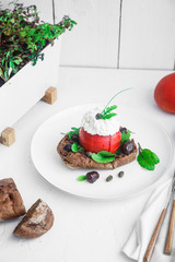 Cretan appetizer dakos. Rusk with feta cheese, tomato, olive oil and olives