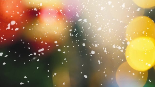 Greeting Season concept.Macro with Dolly of ornaments on a Christmas tree with decorative light and falling snow in 4k (UHD)