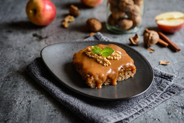 Walnut cake with grated apple layer and caramel toping