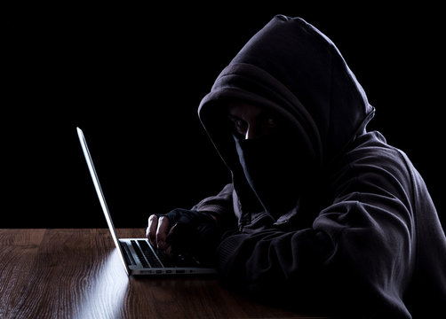 Anonymous hacker in the dark