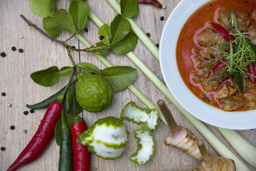 Delicious chicken panang curry and ingredient spice on wooden background, thai food, selected focus.