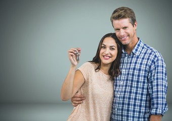 Couple Holding key in front of vignette