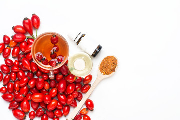 dog rose hips and herbal Te a on white background 