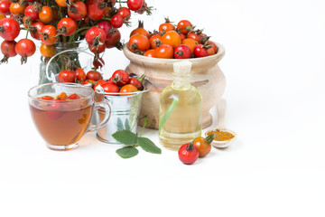 dog rose hips and herbal Te a on white background 