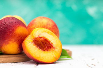 Fototapeta na wymiar a lot of fresh peaches on a white table
