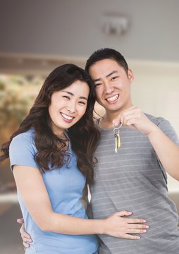 Couple Holding key  in home