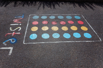children's game twister on the asphalt