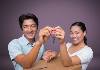 Couple Holding key in front of vignette