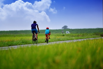 Fototapeta premium cycling with parent and child