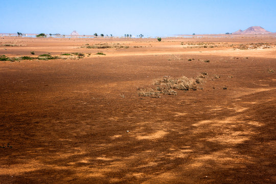 Desert fields in North Sal Island, Cape Verde. Mirage at horizon