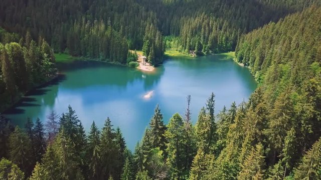 Aerial flythrough of beautiful mountains and forest and lake 7