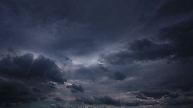 Loop Timelapse Of Clouds And Stormy Night With Sun Rays 1080P. Loop At 1920x1080