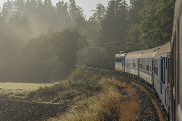 Obraz premium Fast train from Prague to south of Bohemia with sunrise