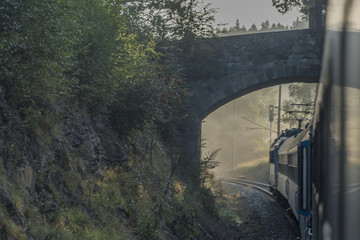 Fast train from Prague to south of Bohemia with sunrise