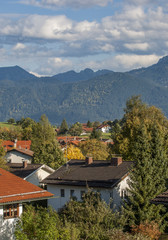 Bavarian village in the Alps in Germany with the Swiss Alps beyond
