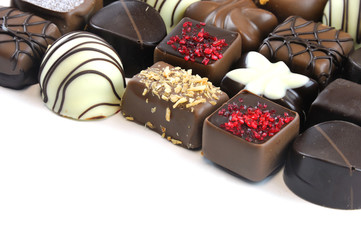 Various colorful chocolate isolated on white background