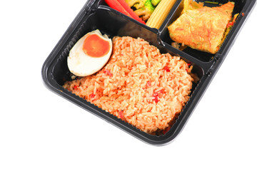 close up fried rice with egg and vegetables in lunch box set  on white background