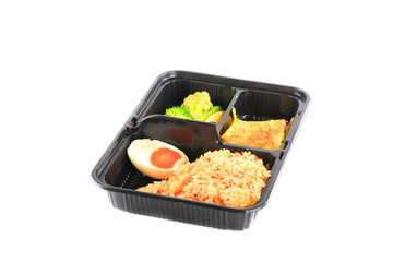 close up fried rice with egg and vegetables in lunch box set  on white background