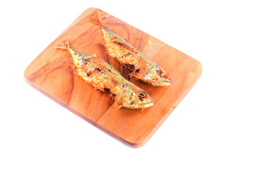 close up two fried mackerel on cutting board isolated  white background and clipping path.