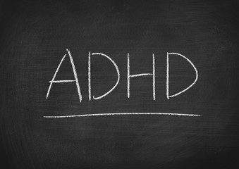 Obraz premium ADHD concept word on a blackboard background