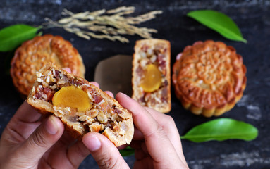woman hand take moon cake
