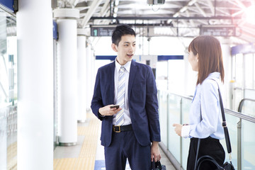 A business couple is talking at the station's home