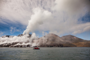 boat watching Snow volcano activity, Chirpoy Island, Russia