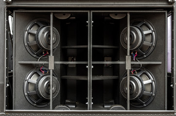 The speakers are black. Audio system. Loudspeakers. Speakers.