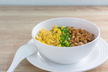 chicken and egg with sauce over rice