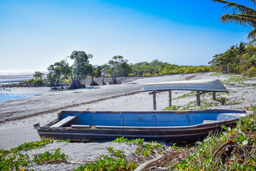 Two boat left on the beach during low tide