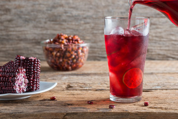 Purple corn juice wood table background