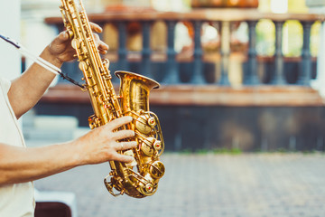 saxophonist plays on the street