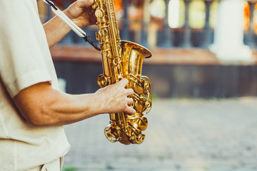 saxophonist plays on the street