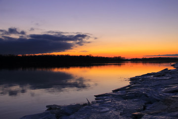 Bright sunset over a river Dnieper on winter