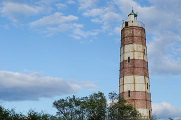 Lighthouse with a cloudy sky