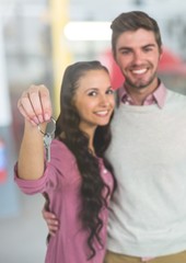 Fototapeta premium Couple Holding Keys with car