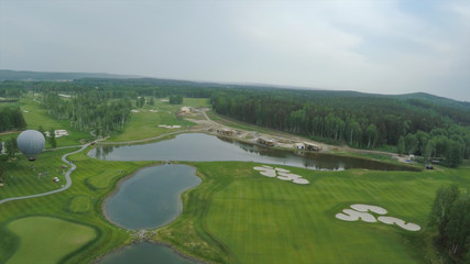 Obraz premium Big air balloon in white color with basket. Aerial on the big balloon