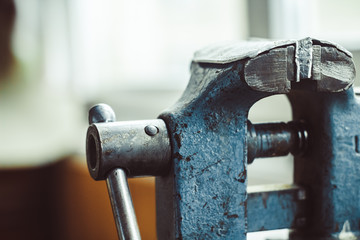 old iron vise on the table