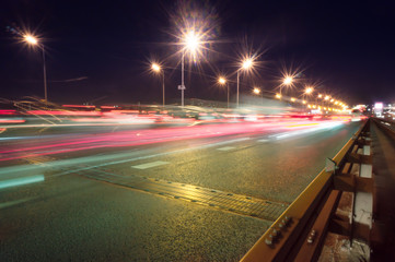 Speed motion,abstract background rays.Traffic car lights on road.