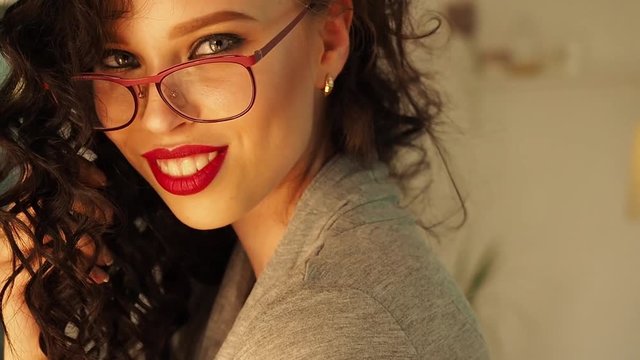 Sexy woman flirts, looks at you smiles and tries to seduce you