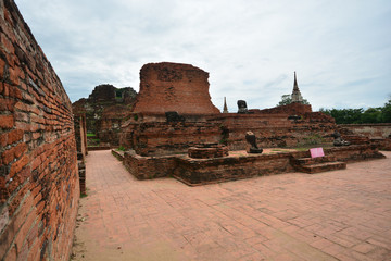 Old brick temple and statue of buddha. Historical national park, Ayuthaya, Thailand